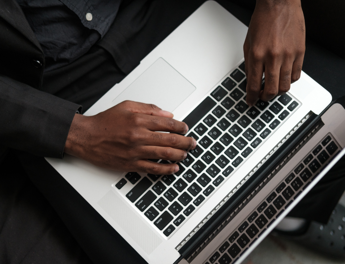 Hands using a laptop