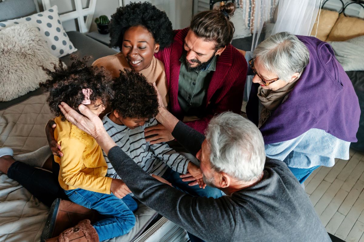 Big intergenerational family spending time in a living room