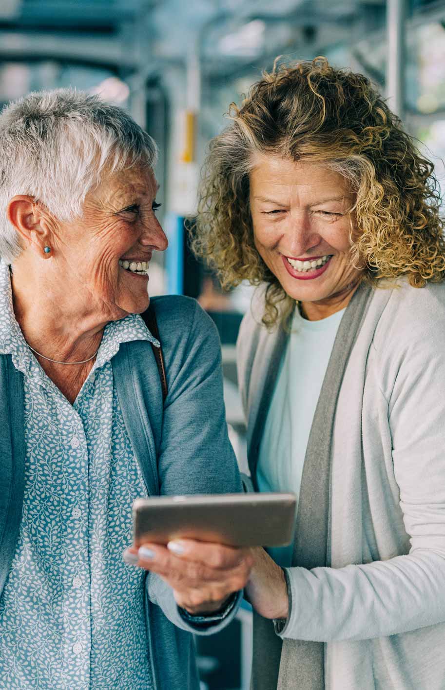 two mature women smiling